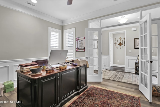 home office with hardwood / wood-style flooring, ceiling fan, crown molding, and french doors