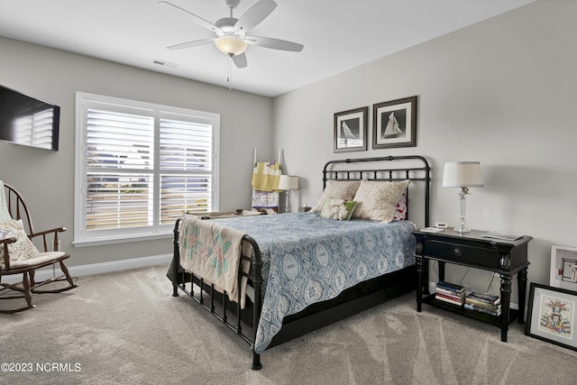 bedroom with ceiling fan and carpet floors