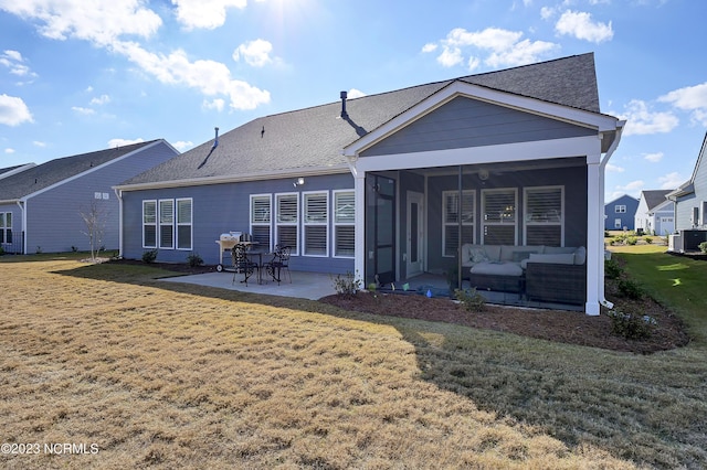 back of property featuring central AC unit, an outdoor living space, a patio, and a lawn