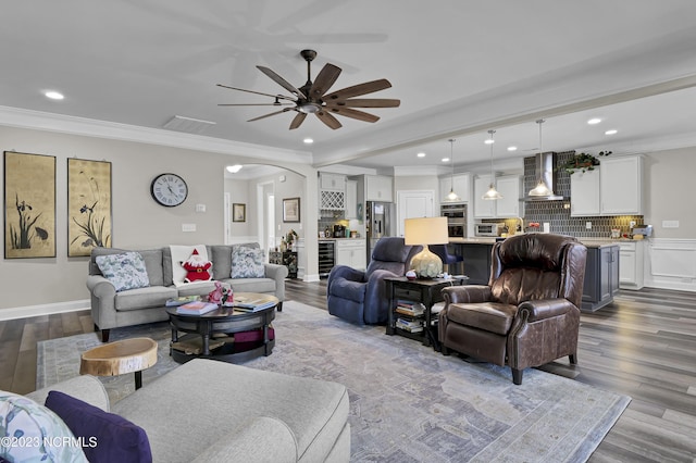 living room featuring ceiling fan, light hardwood / wood-style floors, ornamental molding, and wine cooler