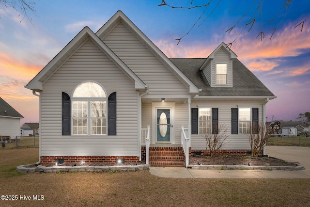 view of front of home with a yard