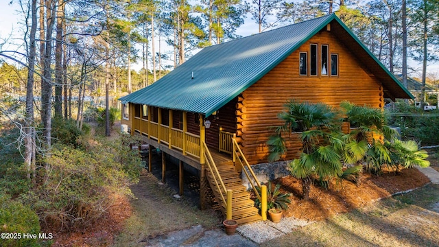 back of property featuring a sunroom