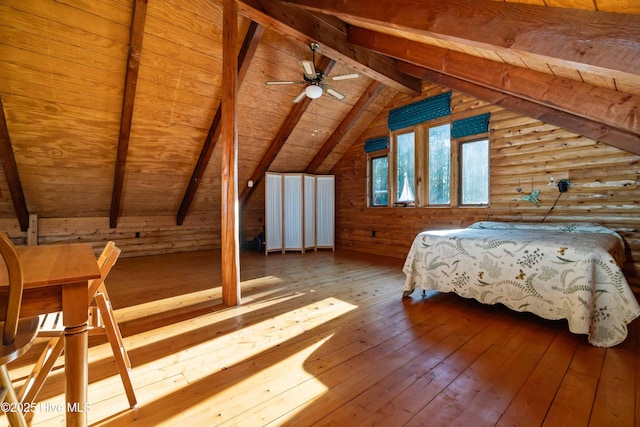 bedroom featuring hardwood / wood-style floors, vaulted ceiling with beams, wood ceiling, and rustic walls