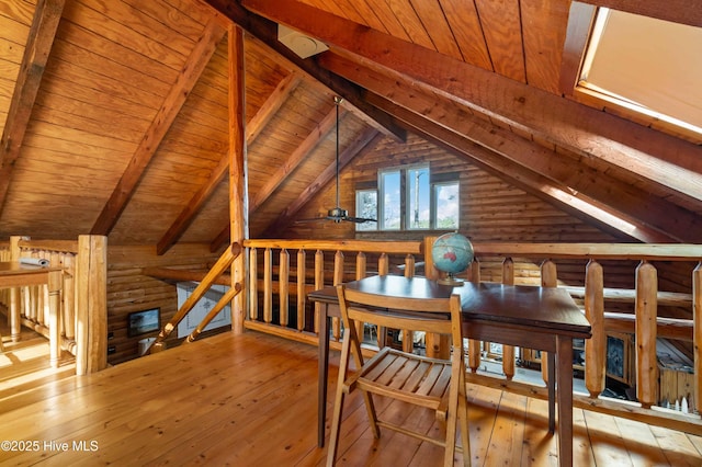 bonus room with log walls, light wood-type flooring, and wood ceiling