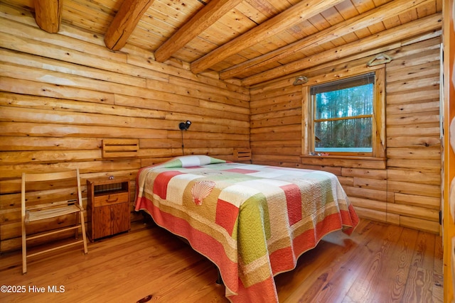 bedroom with hardwood / wood-style flooring, beam ceiling, wooden ceiling, and rustic walls