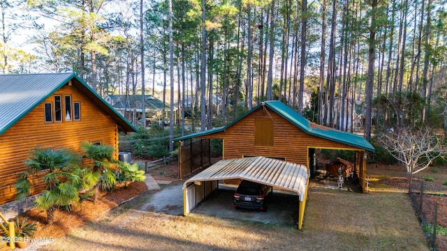 view of side of home featuring a carport