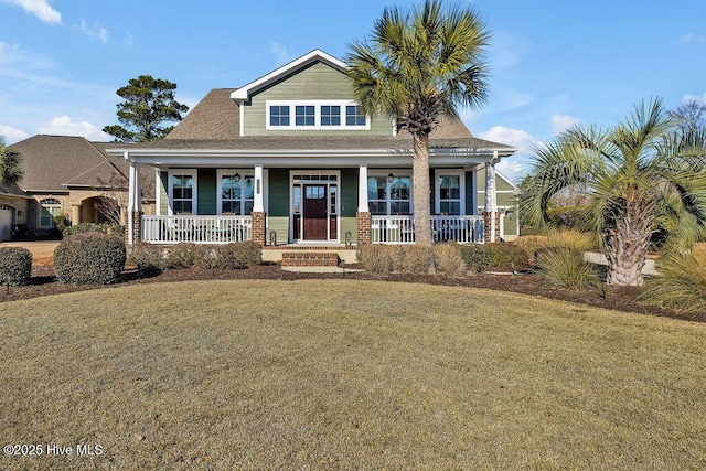 view of front facade featuring a porch and a front lawn