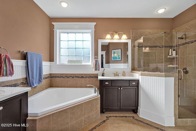 bathroom featuring vanity, tile patterned flooring, and independent shower and bath