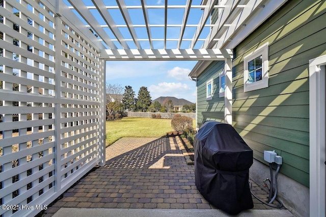 view of patio / terrace with a pergola and area for grilling