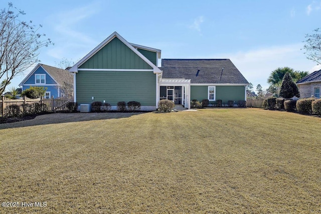 back of house with a pergola, central air condition unit, and a lawn