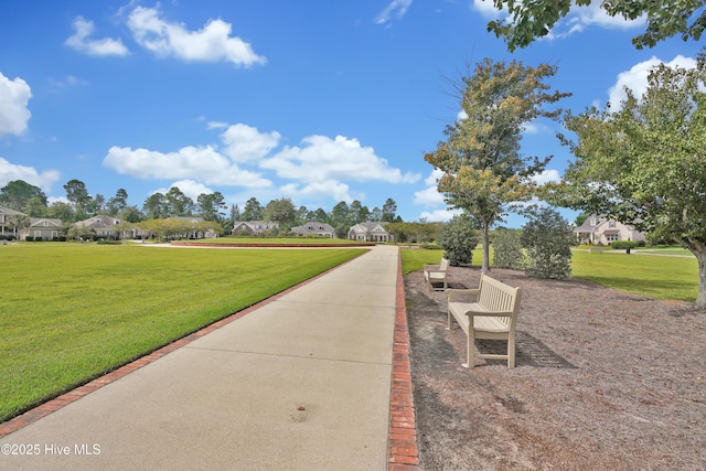 view of home's community featuring a lawn