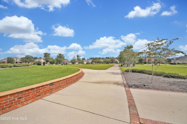 surrounding community featuring a lawn