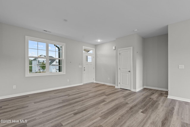 foyer with light hardwood / wood-style floors