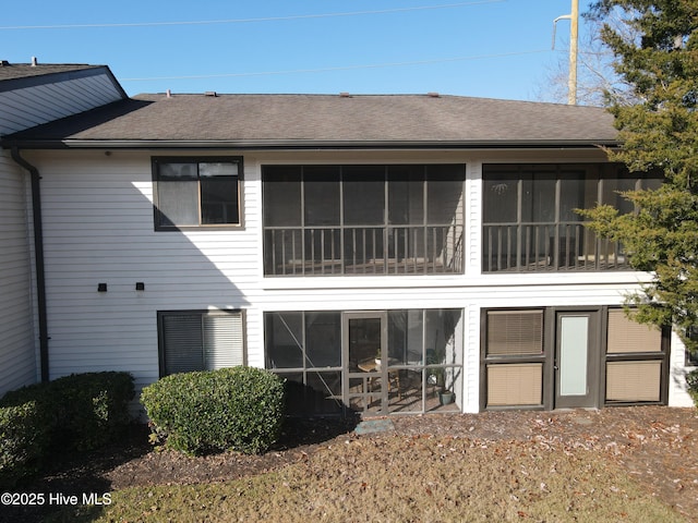 back of property featuring a sunroom