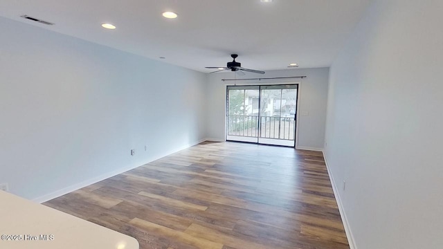 empty room featuring ceiling fan and light wood-type flooring