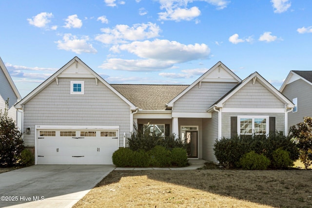 view of front facade with a garage and a front yard