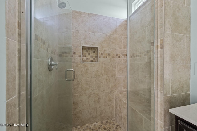 bathroom featuring vanity and walk in shower