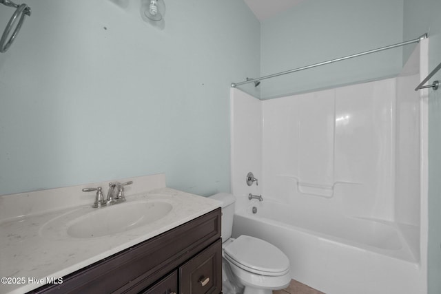 full bathroom featuring vanity,  shower combination, and toilet