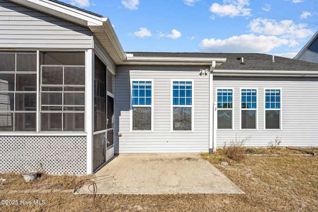 back of property with a patio