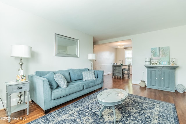 living room with dark wood-type flooring