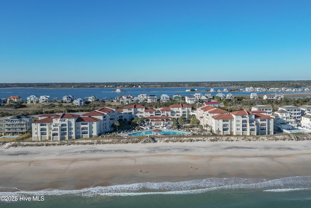 aerial view featuring a view of the beach and a water view