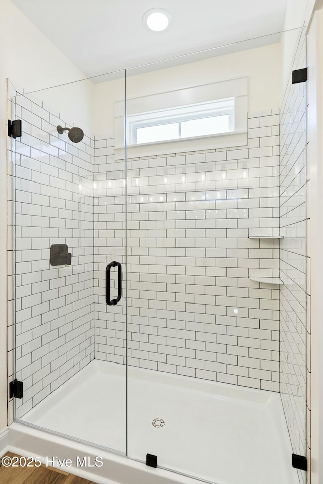 bathroom featuring an enclosed shower