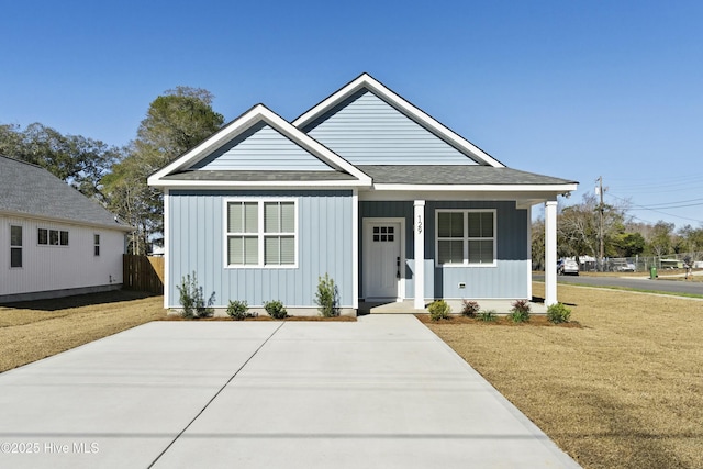 view of front facade with a front lawn and a porch