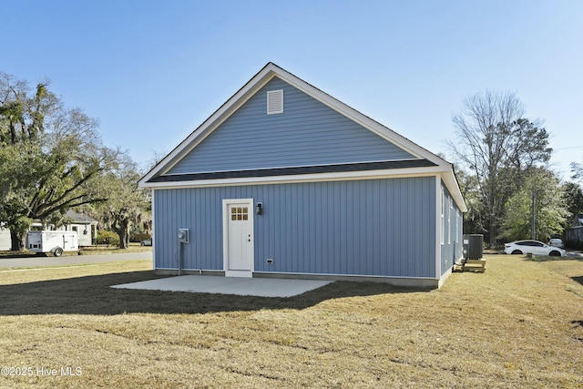 exterior space with a lawn and central air condition unit