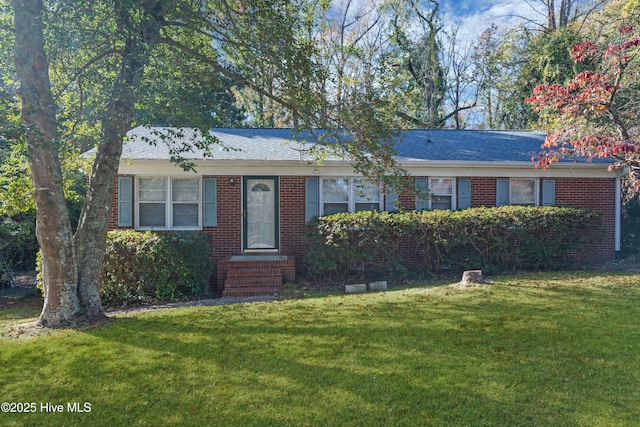 ranch-style house with a front yard