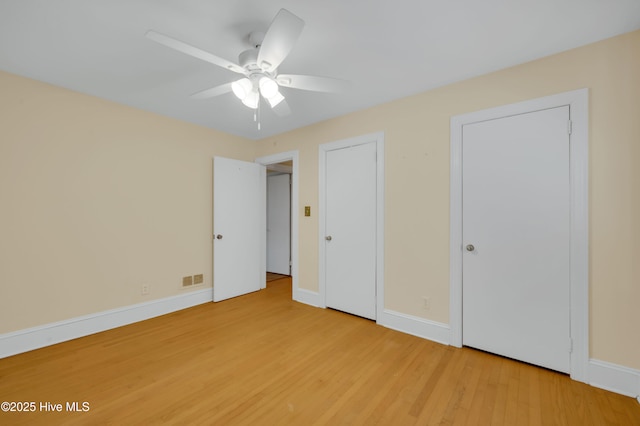 unfurnished bedroom featuring ceiling fan and hardwood / wood-style floors