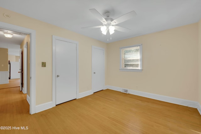 unfurnished bedroom with light hardwood / wood-style flooring and ceiling fan