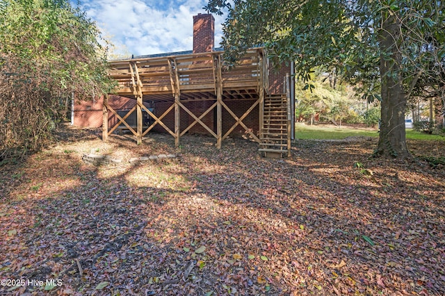 back of house with a wooden deck