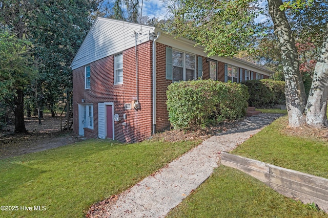 view of home's exterior with a yard