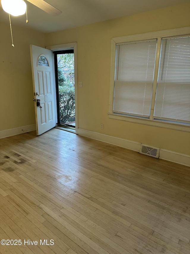 entrance foyer featuring ceiling fan and light hardwood / wood-style floors