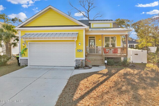 view of front facade with a garage and a porch