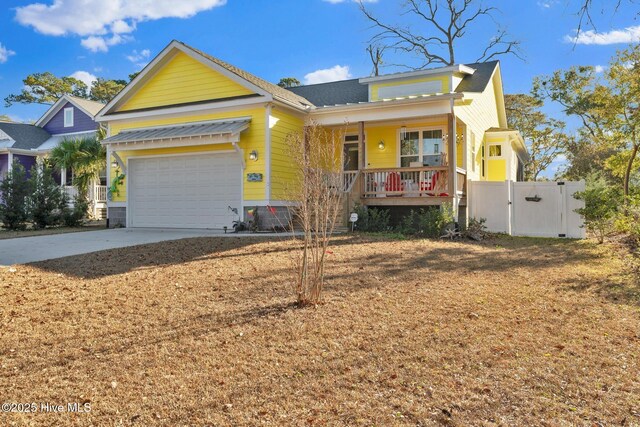 view of front of house featuring covered porch and a garage