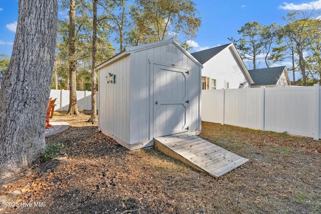 view of shed featuring a fenced backyard