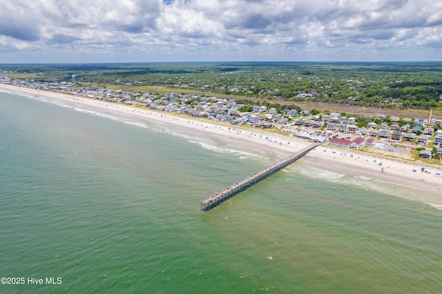 drone / aerial view featuring a beach view and a water view