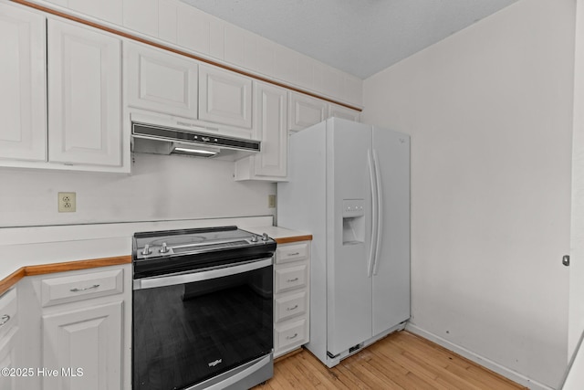 kitchen featuring white cabinetry, light wood-type flooring, white refrigerator with ice dispenser, a textured ceiling, and stainless steel range with electric stovetop