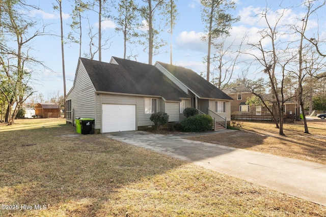 view of front of home featuring a front lawn and a garage