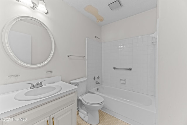 full bathroom featuring shower / bathing tub combination, a textured ceiling, toilet, and vanity