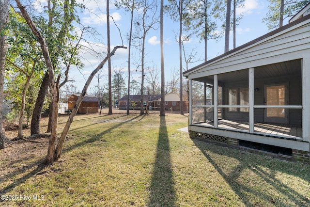 view of yard with a sunroom