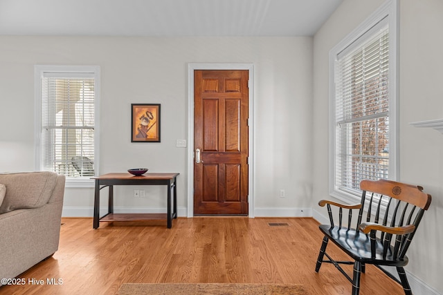 sitting room with light hardwood / wood-style floors