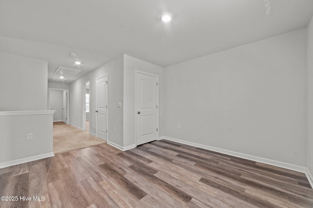 empty room with hardwood / wood-style floors