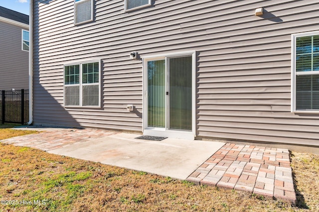 entrance to property featuring a patio area