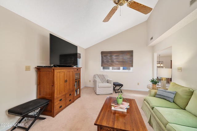 living room featuring light colored carpet, high vaulted ceiling, and ceiling fan with notable chandelier