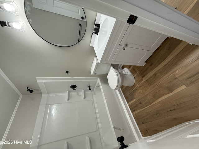 bathroom with wooden walls and toilet