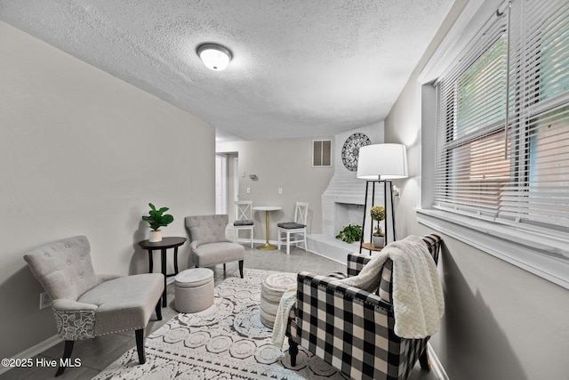 living room with a textured ceiling