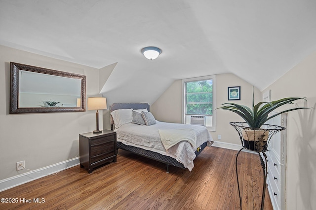 bedroom featuring cooling unit, wood-type flooring, and lofted ceiling