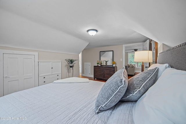 bedroom with lofted ceiling